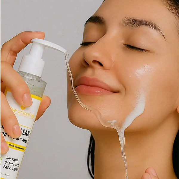 A woman applying The Essentials Acne Clear Hydrating Face Wash, with the clear gel flowing smoothly onto her face, showcasing its foamy texture and gentle cleansing effect. Close-up skincare routine highlighting clean, radiant, and acne-free skin.