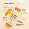 he Essentials Vitamin C Éclat Face Wash bottle placed on a beige background with ingredient visuals and text callouts: 3-O-Ethyl Ascorbic Acid (Vitamin C) for brightness, Cocamidopropyl Betaine & Decyl Glucoside for gentle cleansing, Panthenol for soothing, Glycerin for hydration, and Licorice Root for brightening.