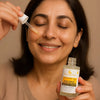 Woman applying Eclat Vitalite Age-Defying Serum – smooth radiant skin with nourishing dropper formula
