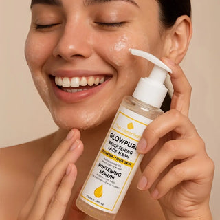 Female model using Glowpure Brightening Face Wash with a glowing smile